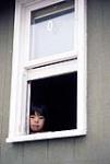 Young girl in window, Repulse Bay 1979.