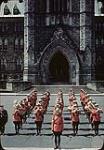 Group of RCMP officers in formation on parliament hill [between 1942 and 1959].