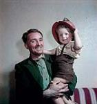 Bill Jardine, a Bell Island, Newfoundland mine foreman, with his three and a half year old son Tom. juillet 1949