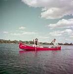 Man and woman canoeing on Dow's Lake, Ottawa, Ontario June 1952