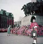 Queen Elizabeth The Queen Mother lays a wreath at the WW II monument, Ottawa, Ontario 11 November 1954