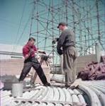 Two men on shipyard dock juillet 1954