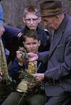 Macoun Club, Ottawa - Herbert Groh examines plant specimens with two boys March 22, 1963
