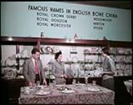 Tourists shop for china at the Hudson's Bay Company Store at Winnipeg, Manitoba. [Touristes magasinant pour de la porcelaine au magazin de la compagnie de la baie d'Hudson à Winnipeg, Manitoba.] octobre 1949.