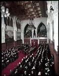 Prime Minister Louis St. Laurent reads an address in the Senate Chamber during the ceremony of installation of Rt. Hon. Vincent Massey as Governor General of Canada. février 1952.