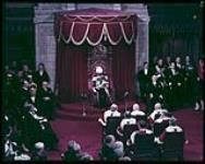 Vincent Massey giving the Speech from the Throne at the Opening of Parliament.  [Vincent Massey prononçant le discours du Trône à l'ouverture de la première session de la nouvelle législature.] [1952-1957].