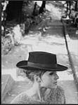 Woman wearing a hat [ca 1955-1976].
