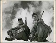 The Lovat Scouts, a Scottish regiment that played a prominent part in the invasion of Europe in WW II learned their mountain tactics and skiing from Canadian instructors high in the Rockies. Two Scouts rest after a day's climbing. The regiment has made some of the first winter climbs of the Rockies' highest peaks, Jasper 1944