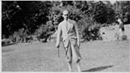 Wilson P. MacDonald holding a golf club [1926]