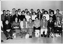 Group portrait of the class [(Front row) unidentified, Kathleen Small, unidentified, Nancy Samson, Alice Mustus, unidentified, Joseph Tobie, unidentified.    (Middle row) unidentified, unidentified, unidentified, unidentified, unidentified, Evangeline Hole, Dora Guly, unidentified, Lucy Isaac, Alphonse Erachi.    (Back row) unidentified, unidentified, unidentified, unidentified, unidentified, 1965