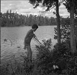 Anna Brown getting out of a lake in Northern Ontario August 2, 1954.