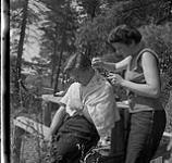 Helen Salkeld getting her hair cut by Anna Brown August-September, 1954.