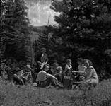 Helen Salkeld, Anna Brown, Audrey James, Rosemary Gilliat and the Thompson family stopping for lunch, Kananaskis, Alberta August 15, 1954.