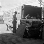 Unloading a Reimer Express Lines Ltd truck, Steinbach, Manitoba June 1, 1956.