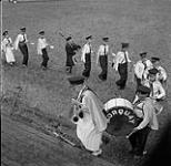 Members of a marching band performing during the Swan River round-up, Manitoba 30 juin 1956.