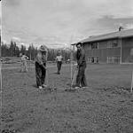 Men working outside, Kitimat, British Columbia June 13, 1956.