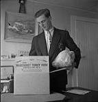 Man holding turkey from Mageehurst Turkey Farm Box [ca.1954-1963]