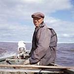Jimmy Spence driving a boat, Prince of Wales Fort, Churchill, Manitoba 1955.
