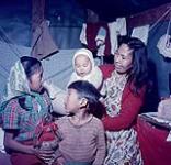 Hilda Irish with her three children, Aklavik, N.W.T. July 17, 1956.