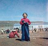Sack race on Canada Day, Frobisher Bay, N.W.T., [Iqaluit (formerly Frobisher Bay), Nunavut] July 1, 1960.