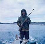 Seal hunter [Laisa Qaqjurajuk] , Frobisher Bay, N.W.T., [Iqaluit (formerly Frobisher Bay), Nunavut] [between June-September, 1960].