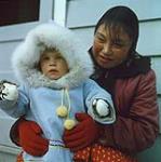 Farleigh Allatt with her nanny Alicat, Cape Dorset, Nunavut [between June-September, 1960].