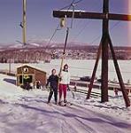 Woman and boy on ski lift, Mont-Tremblant, Quebec February 1961