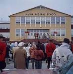 Governor General Vanier addressing the residents of Inuvik, Northwest Territories, from the entrance to Inuvik's Federal School June 1961