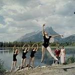 Group of young ballet dancers practising beside Vermillion Lake. Mt. Rundle can be seen in the background. Alberta [Groupe de jeunes danceurs ballet practiquant près de Vermillion Lake. Le Mt. Rundle est appercu a l'arrière-plan. Alberta] juillet 1957.