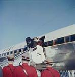 H. M. Queen Elizabeth stepping down from the cabin of the BOAC's DC7, which carried her across the Atlantic Ocean, at Uplands Airport, Oct. 12, 1957. Ottawa, Ont. October 12, 1957.