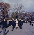 Her Majesty Queen Elizabeth II accompanied by Veterans Affairs Minister the Hon. A.J. Brooks, greeting representatives of veterans' groups following the wreath-laying service at the National War Memorial, Ottawa, October 13, 1957. October 13, 1957.