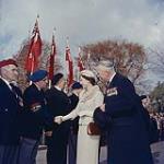Her Majesty Queen Elizabeth II accompanied by Veterans Affairs Minister the Hon. A.J. Brooks, greeting representatives of veterans' groups following the wreath-laying service at the National War Memorial, Ottawa, October 13, 1957. 13 octobre 1957.