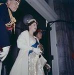 Her Majesty, Queen Elizabeth II and H.R.H. Prince Philip pausing in the arch at Rideau Hall, prior to the drive to the Parliament Buildings to open Canada's 23rd Parliament, Oct. 14, 1957. Ottawa, Ont. October 14, 1957.