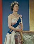 Queen Elizabeth II wearing the Vladimir Tiara, the Queen Victoria Jubilee Necklace, the blue Garter Riband, Badge and Garter Star and the Royal Family Orders of King George V and King George VI 1959