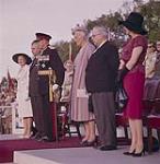 The official party at the evening performance of the Canadian Guards at the Dominion Day ceremony. Left to right: Mrs. J Diefenbaker; Hon. J. Diefenbaker; Gov. Gen. Vanier; Mme. Vanier; Hon. P. Savigny and Mrs. Savigny. Ottawa, Ontario.  01 juillet 1961