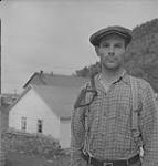 Gaspé 1951, (2) portrait of a man in front of a barn 1951