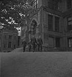 Toronto, servicemen walking outside a building [between 1939-1951].