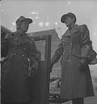 Woman's Air Force, 1940's. Unidentified Man in Uniform Opening Car Door for Unidentified Woman in Uniform [entre 1940-1949]