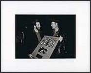 Deane Cameron presenting Stompin' Tom Connors with an award [ca 1990].