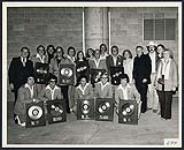 Group portrait including Carlton Showband holding gold records, Ross Reibling - Ross Sound, RCA Records Staffers and Father Hefferman (?) - 'Church Today' on Global TV [entre 1966-1981].