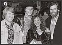 Stompin' Tom Connors posing with Deane Cameron along with an unidentified man and woman [between 1990-2000]