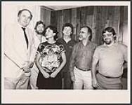 Pictured left to right: Stan Kulin (WEA Canada President), John Welsman, Cherie Camp, Bob Roper (WEA Canada A & R Manager), Ross Reynolds, (WEA Canada Executive Vice President) and Garry Newman (WEA Canada Vice President, Sales) [between 1983-1985].