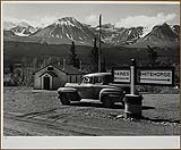 Mile 1016 Alaska Highway where the Haines cut-off roads leads 154 miles to the seaport of Haines, Alaska 1949.