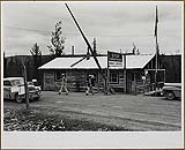 The Canadian Customs and Immigration Office at Mile 1221, Alaska Highway, looks almost too rustic for pride 1949