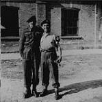 Snap-shot of two servicemen. On the right is Johnny Lombardi [ca. 1940]