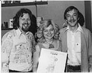 Portrait of Great Rufus Road Machine's Ron and Sharon Russell with CJOC's DJ Glenn Moore. Lethbridge [entre 1976-1979].