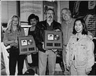 L to R: Kim Blake (Bruce Allen Talent), Michelle Stewart (BMG Music Branch Manager), Ray Ramsay (BMG Music Promotions Representative), Bruce Allen (Bruce Allen Talent), and Katherine Wong (BMG Music) holding an award for Martina McBride's record The Way That I Am [between 1993-1994].