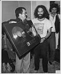 L to R: Gord Edwards (President of GRT Records), Dan Hill, and Jeff Burns (V.P. of A&R for GRT). Photo taken during a cocktail reception and awards presentation held in honour of Dan Hill [ca 1977].