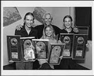 Mercury/Polydor president Doug Chappell presents Hanson (Isaac, Zachary and Taylor) with double and triple platinum awards for their album 'Middle of Nowhere,' Hanson were in Toronto to participate in YTV's Psyko Blast at Canada's Wonderland ca. 1997.