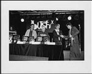 Portrait of the band Bush X on stage receiving an award [ca. 1994-1995]